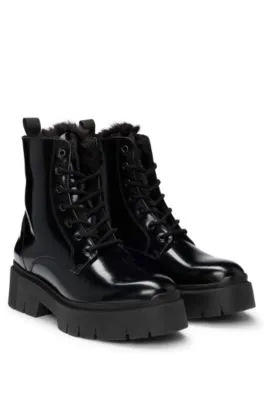 Faux-leather boots with logo zip-puller