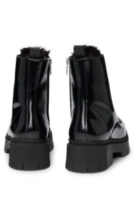 Faux-leather boots with logo zip-puller