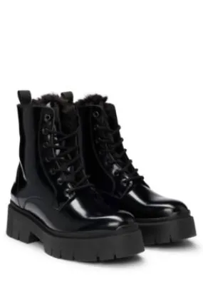 Faux-leather boots with logo zip-puller