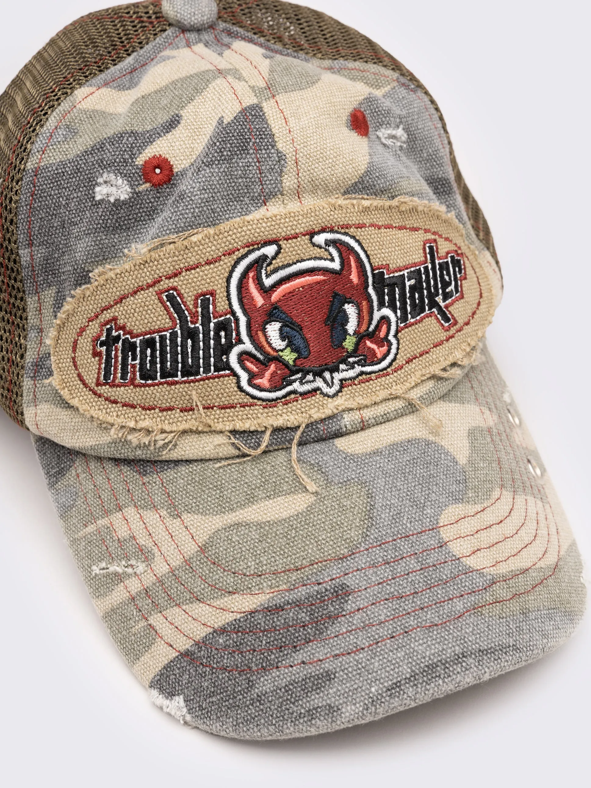 Troublemaker Camo Distressed Trucker Hat